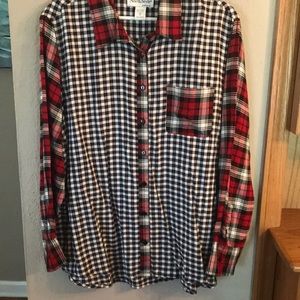 Unique shirt.  Red plaid sleeves.  Black check with red plaid trim and pocket.